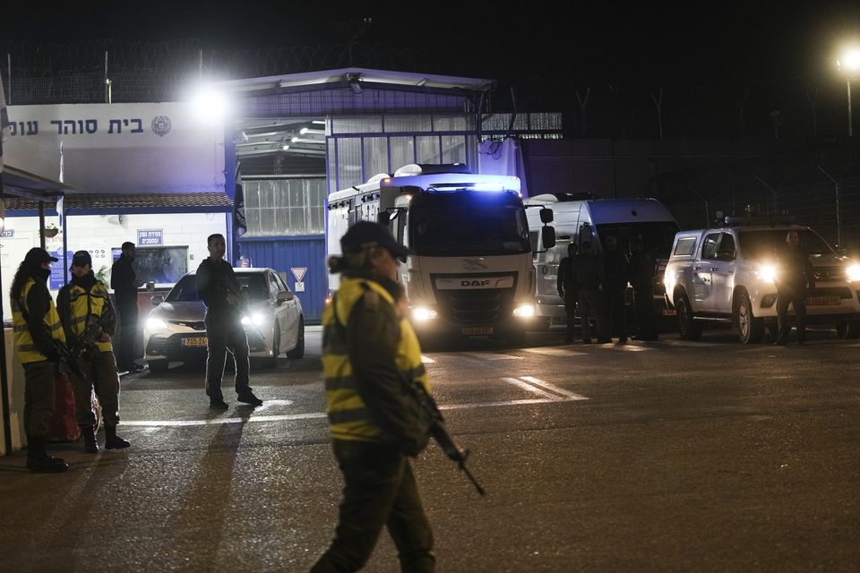 An Israeli prison transport vehicle carries Palestinian prisoners released by the Israeli authorities from Ofer military prison (Mahmoud Illean/AP)